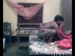 An very dark-skinned, untrained Indian husband drills his wifey missionary